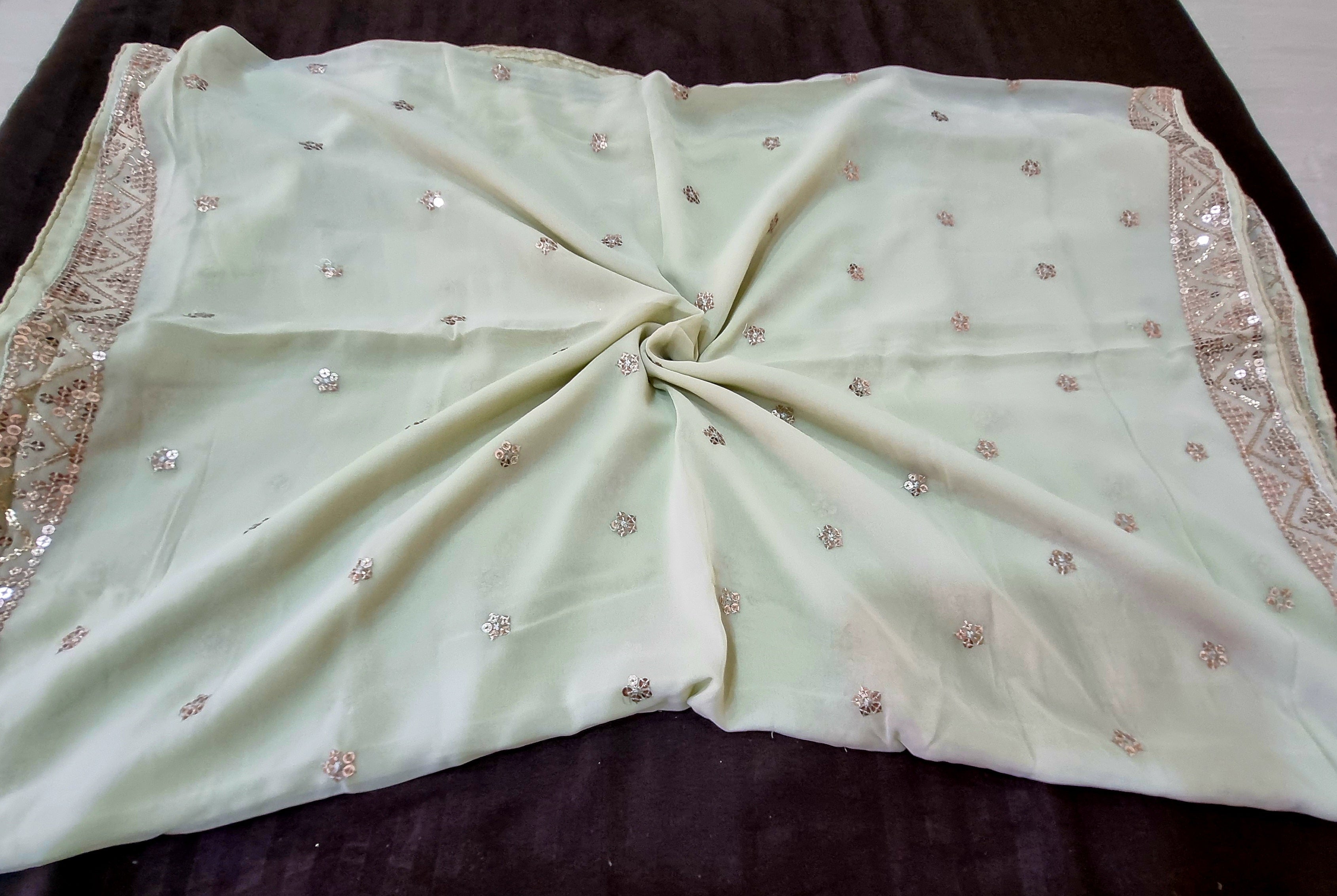 पिस्ता हरा शुद्ध जॉर्जेट सीक्वेंस वर्क ड्रेस मटीरियल